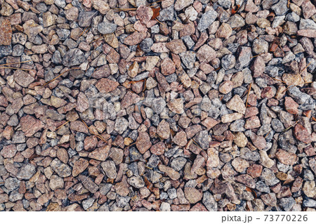 Background of natural grey granite crushed stone, macadam. Macro photo of texture of broken stone or rubble with place for text. Crushed rock. Construction Materials. Textures Background of natural grey granite crushed stone, macadam. Macro photo of texture of broken stone or rubble with place for text. Crushed rock. Construction Materials. Textures 73770226