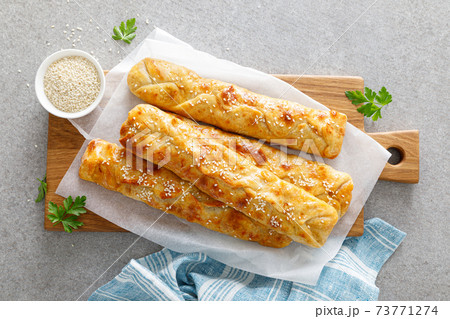 Freshly baked homemade savory puff pastries patties, rollini Freshly baked homemade savory puff pastries patties, rollini 73771274