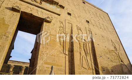 Entrance of Edfu temple of Horus majestic beautiful landmark with ancient blue paint on wall Entrance of Edfu temple of Horus majestic beautiful landmark with ancient blue paint on wall 73772824