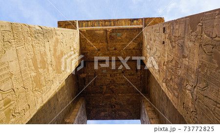 Entrance of Edfu temple of Horus majestic beautiful landmark with ancient blue paint on wall Entrance of Edfu temple of Horus majestic beautiful landmark with ancient blue paint on wall 73772825