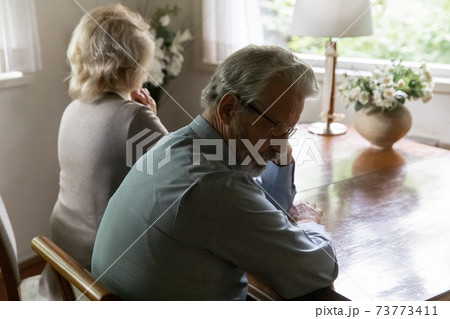 Close up offended mature man and woman ignoring each other Close up offended mature man and woman ignoring each other 73773411