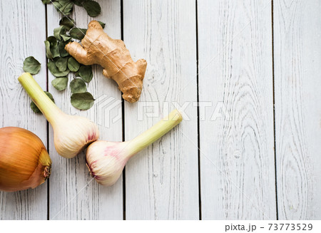 ingredients for immune boosting, garlic, onion, ginger, eucaliptus leaves. ingredients for immune boosting, garlic, onion, ginger, eucaliptus leaves. 73773529