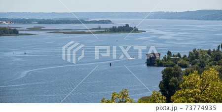 Dnipro river summer panoramic landscape, Kaniv water Reservoir, Kyiv Region, Ukraine. Dnipro river summer panoramic landscape, Kaniv water Reservoir, Kyiv Region, Ukraine. 73774935