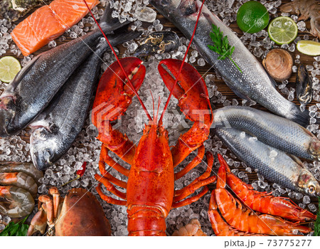 Whole lobster with seafood, crab, prawns, fish, - Stock Photo
