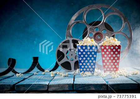Cinema concept of vintage film reels, clapperboard and other tools 73775391