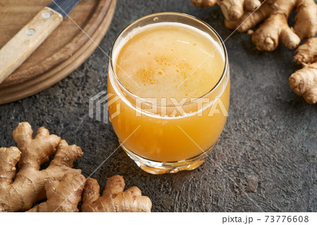 A glass of probiotic sparkling drink with ginger 73776608