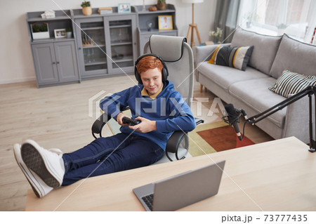 Red Haired Boy Playing Video Games Red Haired Boy Playing Video Games 73777435