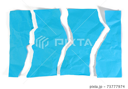 torn piece of blue paper isolated on white background, top view 73777974