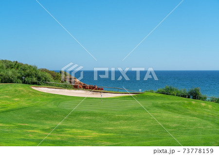 Resort luxury beaches, golf courses with palm trees, overlooking the sea for tourists to relax. Portugal algarve Resort luxury beaches, golf courses with palm trees, overlooking the sea for tourists to relax. Portugal algarve 73778159