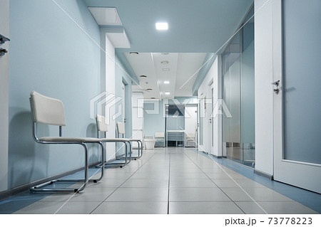 Empty modern hospital corridor, clinic hallway interior background. Empty modern hospital corridor, clinic hallway interior background. 73778223
