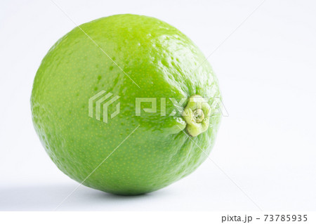 Green lime on white background.fresh lime.Lemon on white scene. Green lime on white background.fresh lime.Lemon on white scene. 73785935