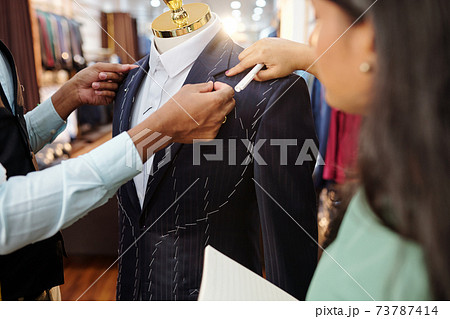 Working on bespoke jacket collar 73787414