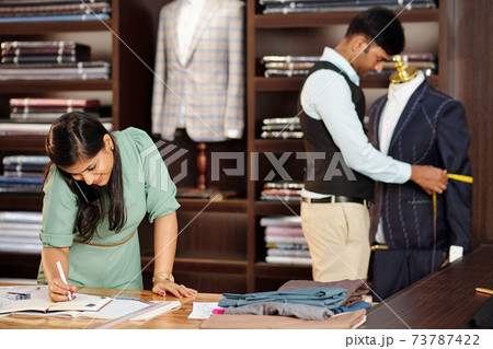 Tailors working in atelier 73787422