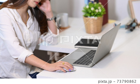 Cropped shot of businesswoman employee frustrated by business problem or work stress at office. Cropped shot of businesswoman employee frustrated by business problem or work stress at office. 73790862