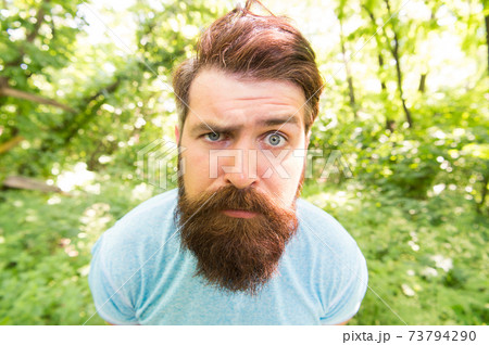 Bearded man closeup. portrait of confused bearded man. 73794290
