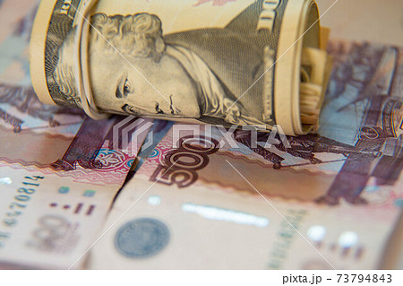 dollars in a tube and ruble bills 73794843