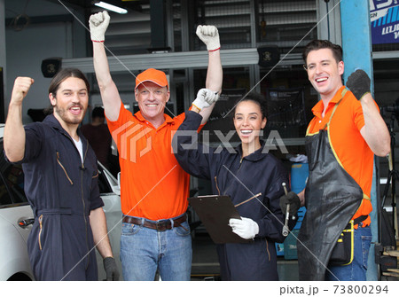 Portrait of a mechanic at work in his garage or car repair service or auto store, business, maintenance and people concept 73800294