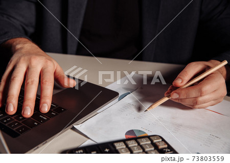 Man makes mark in a chart. Investment and business concept Man makes mark in a chart. Investment and business concept 73803559