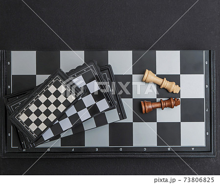 Four chessboards of different sizes lying on top of each other. 73806825