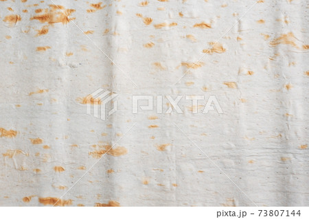 Close up Background Thin Armenian lavash. Texture of natural bread baking. 73807144