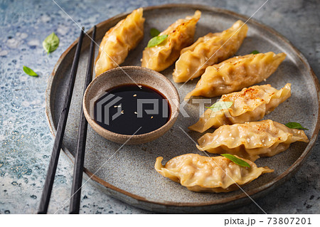 Asian dumplings with soy sauce Asian dumplings with soy sauce 73807201