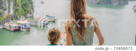 BANNER, LONG FORMAT Mom and son travelers in Halong Bay. Vietnam. Travel to Asia, happiness emotion, summer holiday concept. Picturesque sea landscape. Ha Long Bay, Vietnam. After coronavirus COVID 19 BANNER, LONG FORMAT Mom and son travelers in Halong Bay. Vietnam. Travel to Asia, happiness emotion, summer holiday concept. Picturesque sea landscape. Ha Long Bay, Vietnam. After coronavirus COVID 19 73808073
