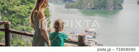 BANNER, LONG FORMAT Mom and son travelers in Halong Bay. Vietnam. Travel to Asia, happiness emotion, summer holiday concept. Picturesque sea landscape. Ha Long Bay, Vietnam. After coronavirus COVID 19 73808090