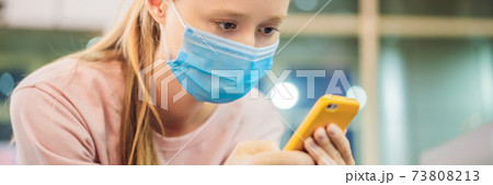 Woman wearing surgical face mask against infectious disease protection against cold common flu. Coronovirus COVID 19 concept BANNER, LONG FORMAT Woman wearing surgical face mask against infectious disease protection against cold common flu. Coronovirus COVID 19 concept BANNER, LONG FORMAT 73808213