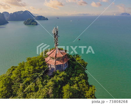 Aerial view panorama of floating fishing village and rock island, Halong Bay, Vietnam, Southeast Asia. UNESCO World Heritage Site. Junk boat cruise to Ha Long Bay. Popular landmark of Vietnam 73808268