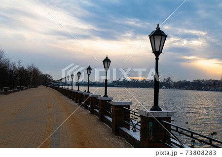 lanterns on the embankment in the winter in the evening 73808283