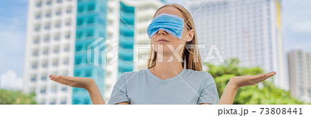 Improper wearing of mask concept. Woman wearing mask wrong BANNER, LONG FORMAT 73808441