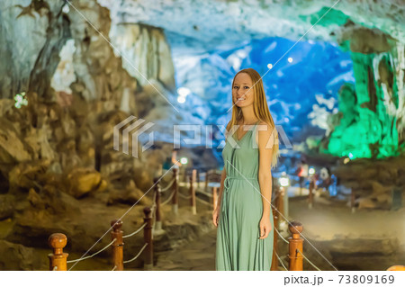 Woman tourist in Hang Sung Sot Grotto Cave of Surprises, Halong Bay, Vietnam Woman tourist in Hang Sung Sot Grotto Cave of Surprises, Halong Bay, Vietnam 73809169