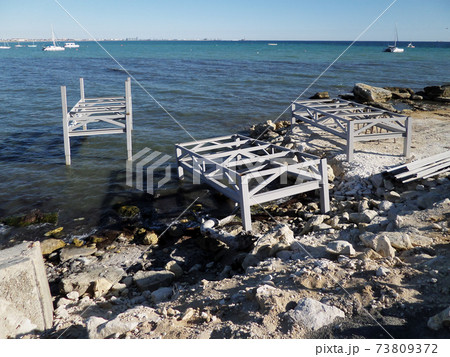 Iron structures on the shore. 73809372