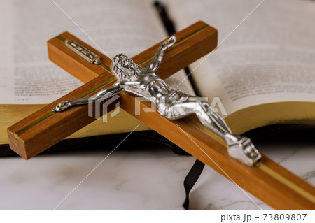 Jesus on way to God through prayer Holy Bible and the crucifix 73809807