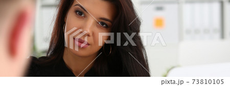 Pretty woman is talking with her colleague Pretty woman is talking with her colleague 73810105