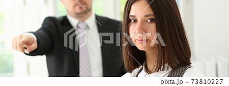 Female office worker getting fired from job Female office worker getting fired from job 73810227