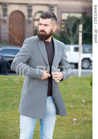 brutal mature bearded man with moustache walking  73810646