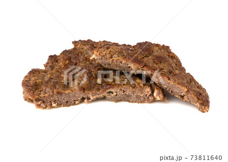 Fried cutlet isolated on white background. Fried beef cutlet for burger cut into two pieces. 73811640