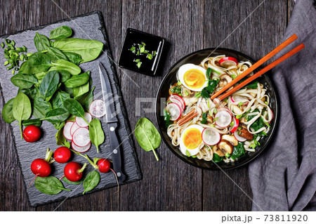 Udon noodle soup in a bowl, top view, close-up Udon noodle soup in a bowl, top view, close-up 73811920