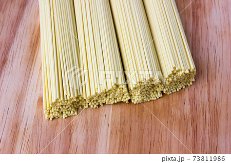 Dry egg noodles. Chinese egg noodles close-up. 73811986