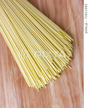 Dry egg noodles. Chinese egg noodles close-up. 73811992