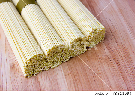 Dry egg noodles. Chinese egg noodles close-up. 73811994