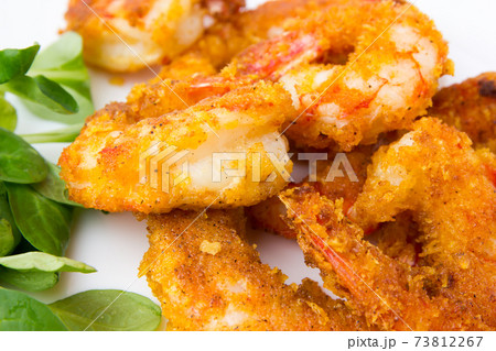 Fried prawns on a white background. Prawns fried in breading close-up. 73812267