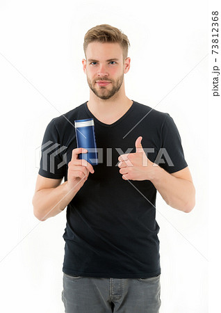 Remedies get rid of dandruff. Man hold bottle shampoo  73812368