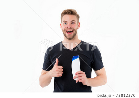 Happy man show thumbs up to shampoo bottle. Bearded 73812370