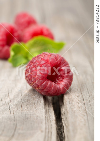 Raspberry on the old a wooden table. Raspberry on the old a wooden table. 73814222