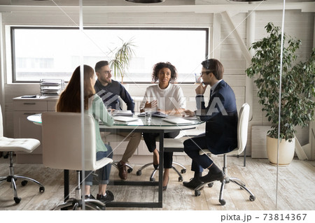 Diverse business people discussing project, brainstorming in modern board room 73814367