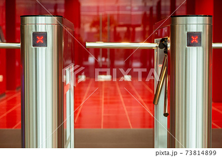 Security office center. Turnstile with card reader. Electronic checkpoint with a turnstile in the office center. Security office center. Turnstile with card reader. Electronic checkpoint with a turnstile in the office center. 73814899