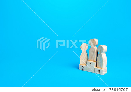People stand on a sports awards podium. First second and third place. Competition concept. Summing up the results of contest. Determination of the winner. Competitive fight. Best of 73816707
