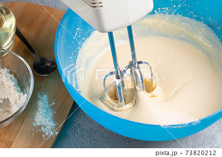 Kneading baking dough with an electric mixer Kneading baking dough with an electric mixer 73820212